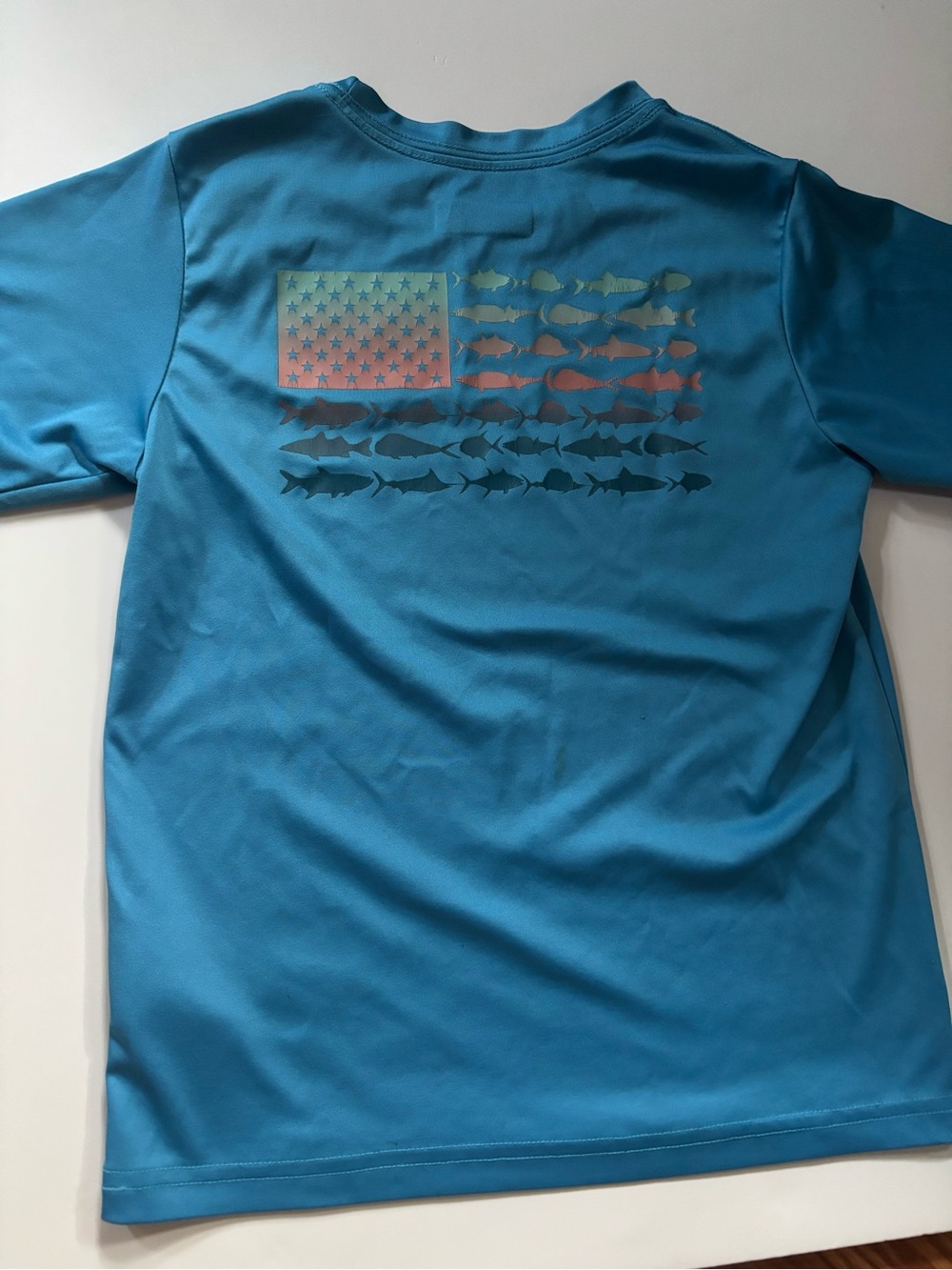Kids Columbia Short-Sleeve Performance Tee in Teal with Fish Flag Graphic